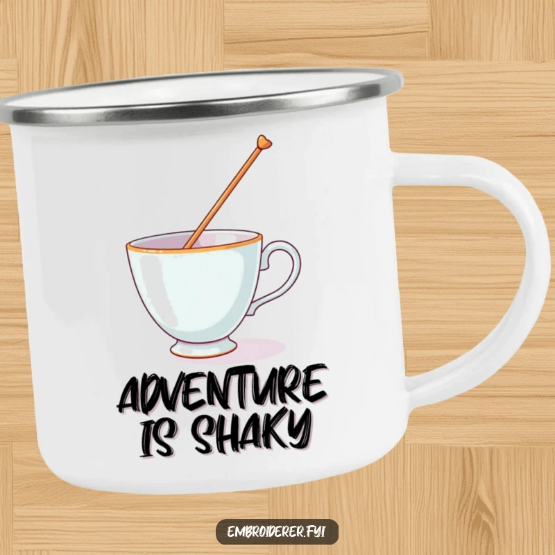 Funny camping mug showing a teacup attempting to balance a huge needle, a humorous companion for outdoor trips.