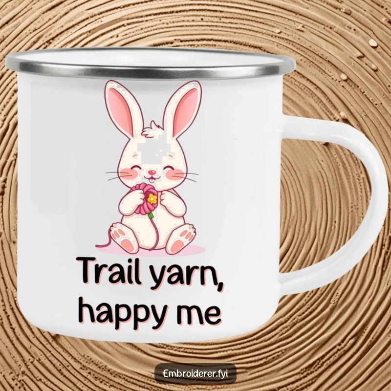 Funny camping mug with a cheerful rabbit embroidering a flower, ideal for enjoying drinks with a humorous, crafty touch outdoors.
