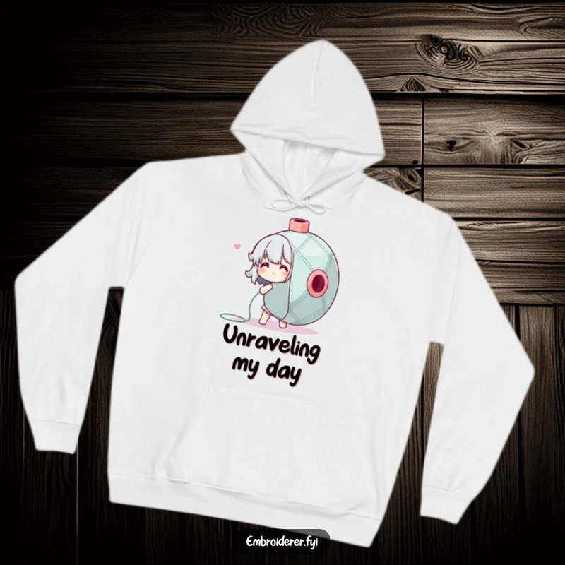 Funny Hoodie showing a character adorably struggling with an oversized spool of embroidery floss, a humorous crafting statement.